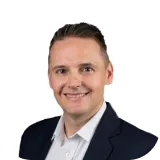 A picture of Ricoh, Head of Portfolio Management (IFAs) at Stanlib Multi-Manager benefitting from interactive reports with Alis Exchange Solutions.